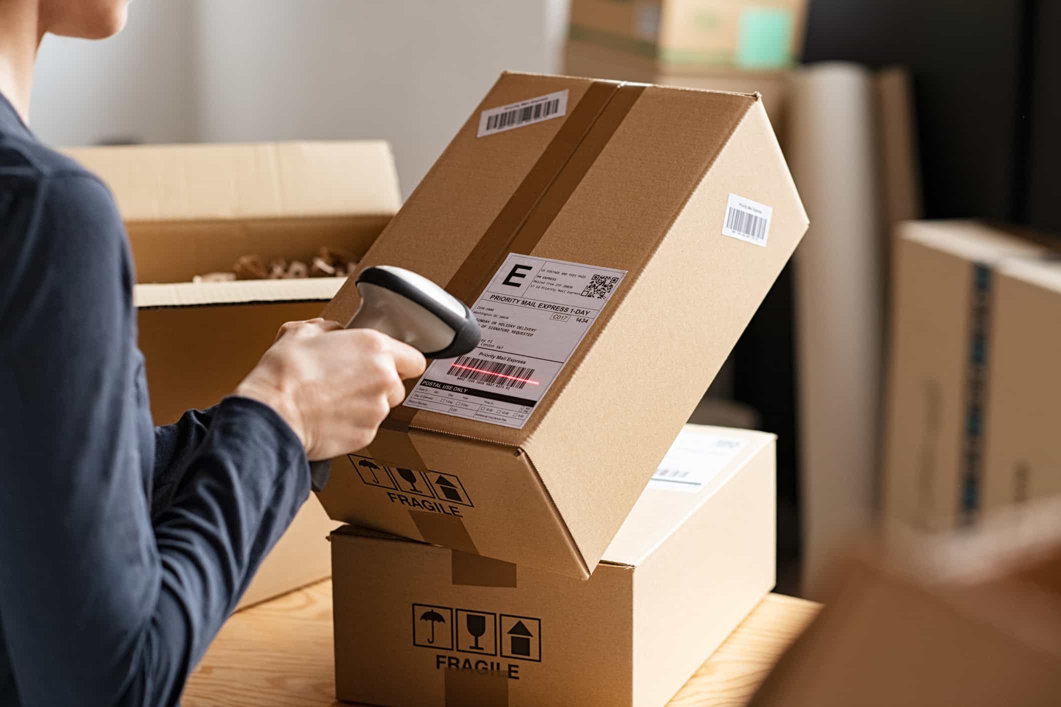 Image of Woman Scanning Package / Parcel